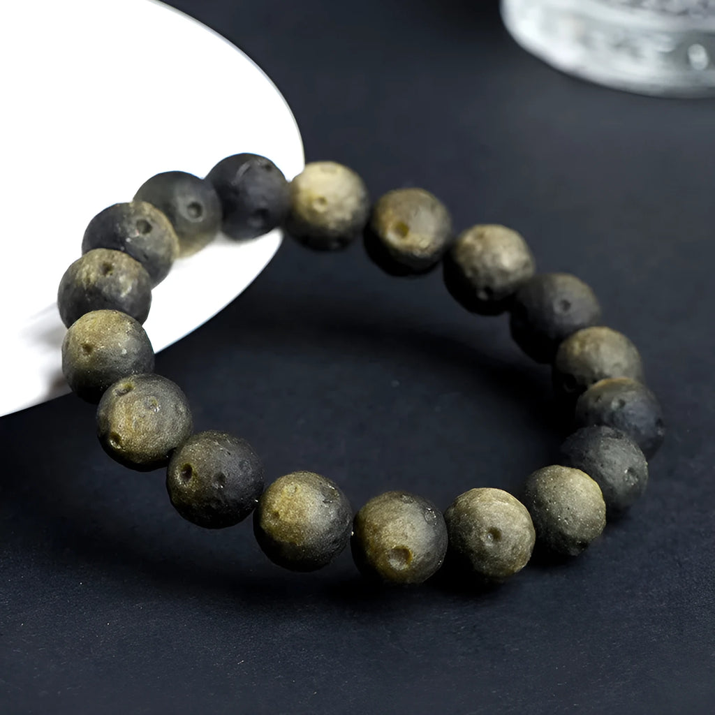 Natural obsidian crater ball bracelet with grinding texture in silver or gold meteorite finish
