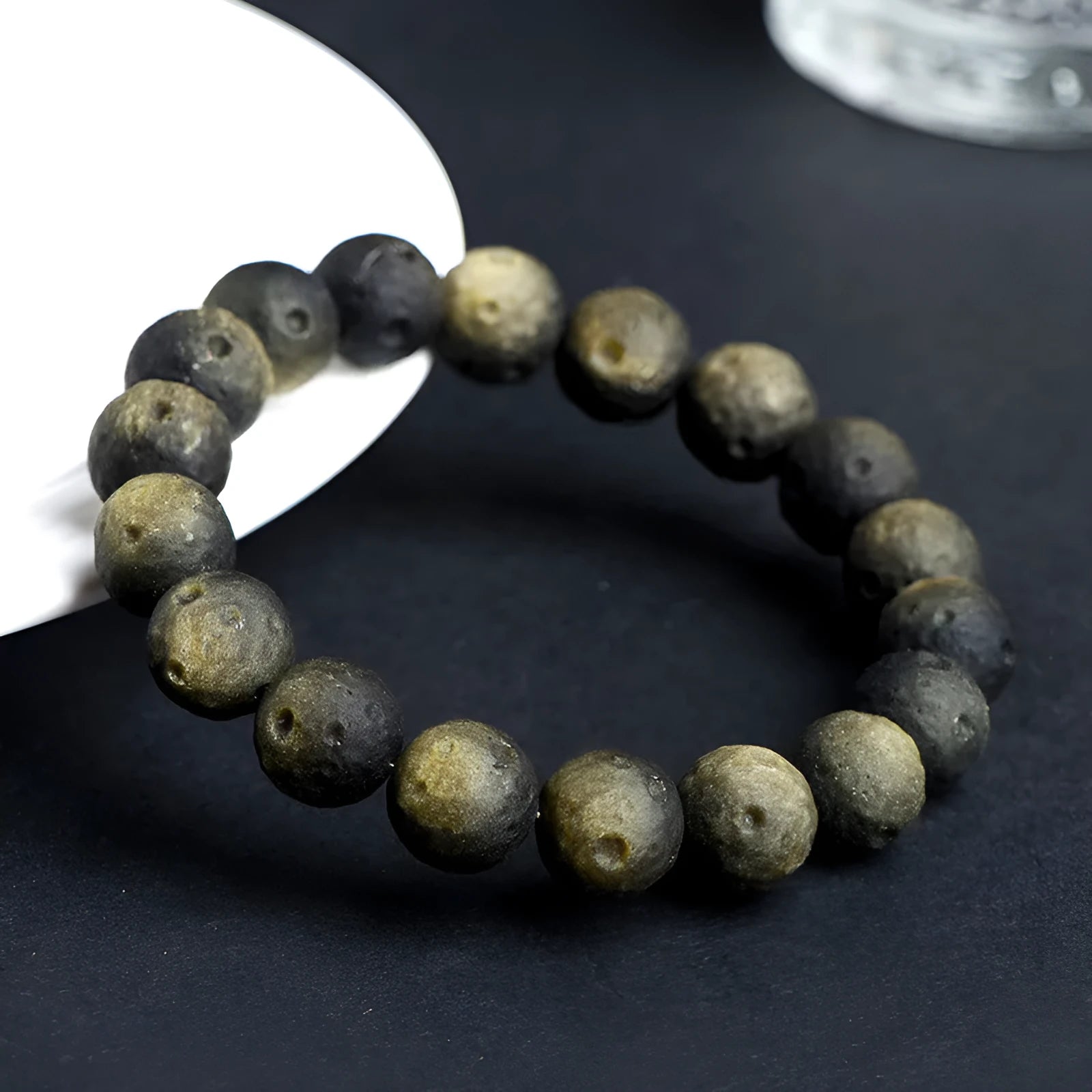 Natural obsidian crater ball bracelet with grinding texture in silver or gold meteorite finish