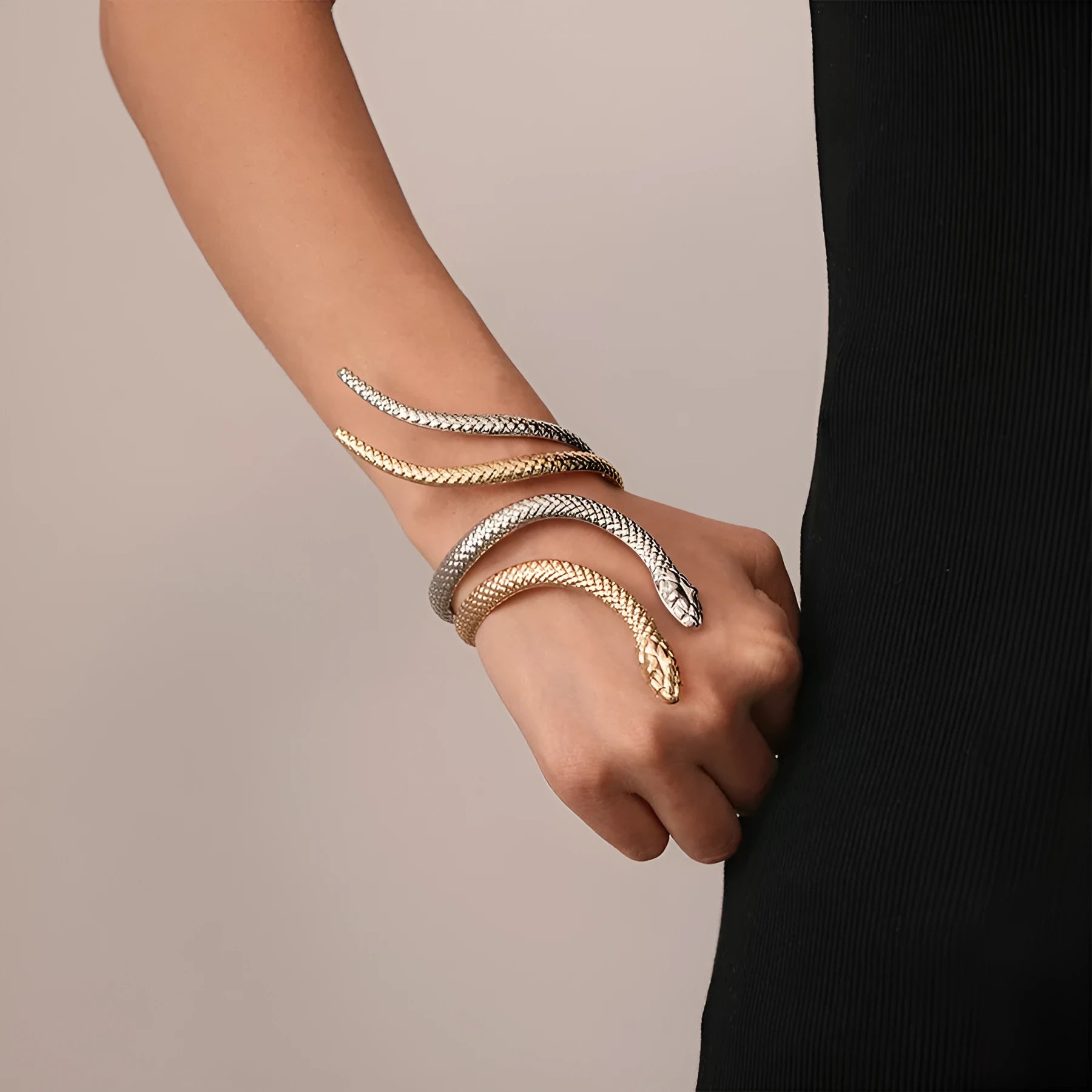Snake-inspired ring and bracelet set with exaggerated twisted winding design in electroplated metal