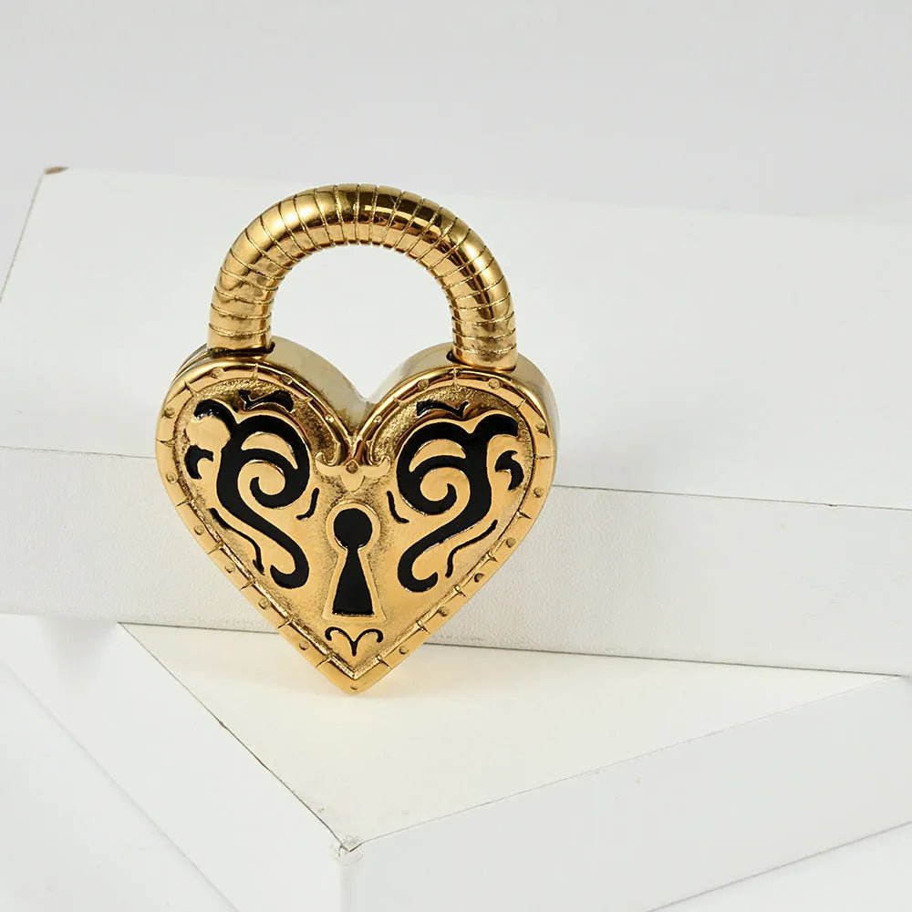 Close-up of a women's stainless steel heart-shaped earring for piercings, shown in gold and steel colour options.