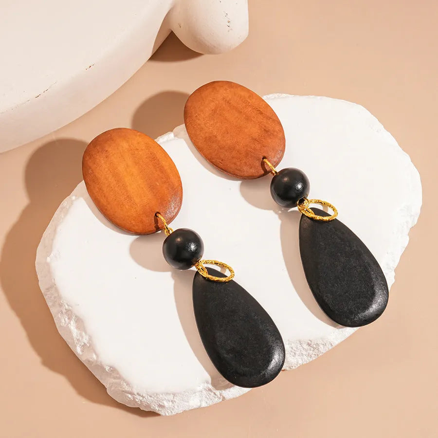 Pair of wooden retro-style ellipse earrings in silver needle-brown-black colour.