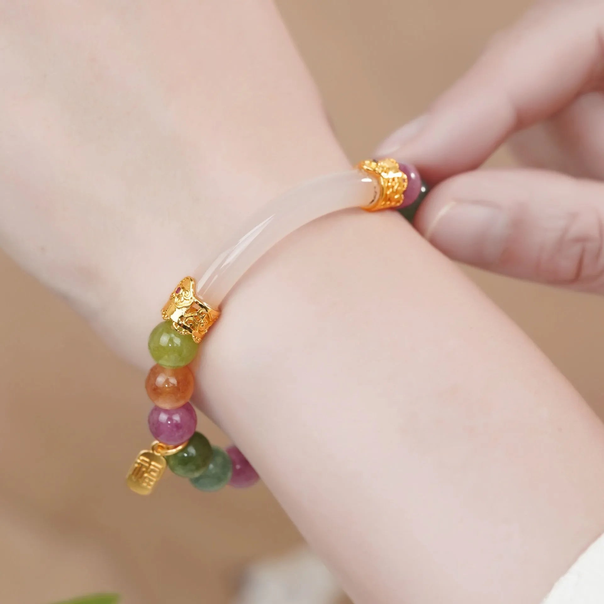 Women's rainbow tourmaline half bracelet with electroplated finish on natural jade pith stones