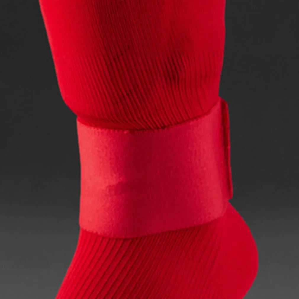 Rubber shin guard magic tape belt in red, blue, black, or white.
