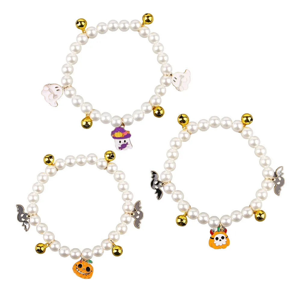 Halloween decorative pet collar with simulated pearls and a pumpkin charm.