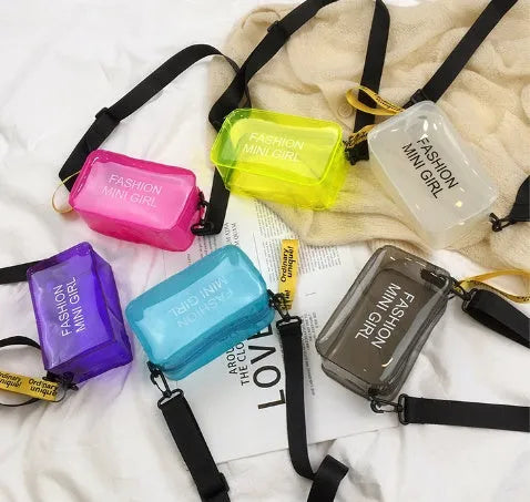 Transparent square jelly shoulder bag with adjustable strap showing internal mobile phone compartment