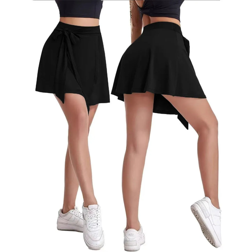 Black thigh-length sports skirt with built-in safety shorts and shoulder straps