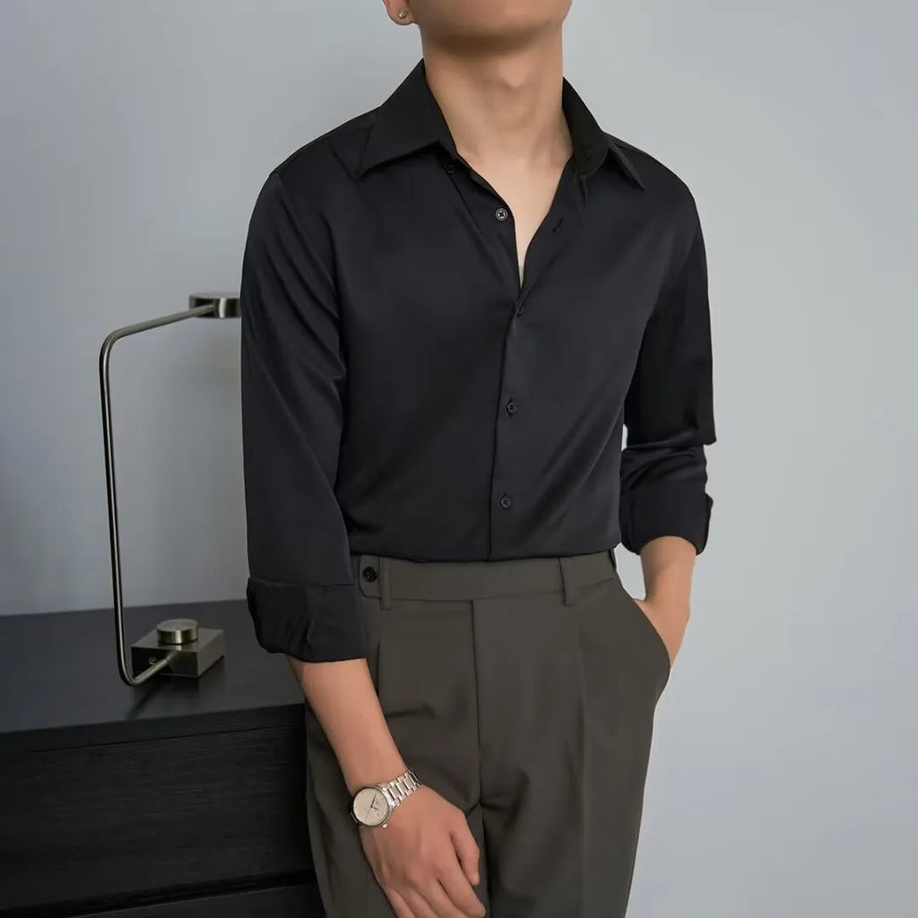 Man wearing a black Japanese retro style loose-fit long sleeve cardigan shirt.