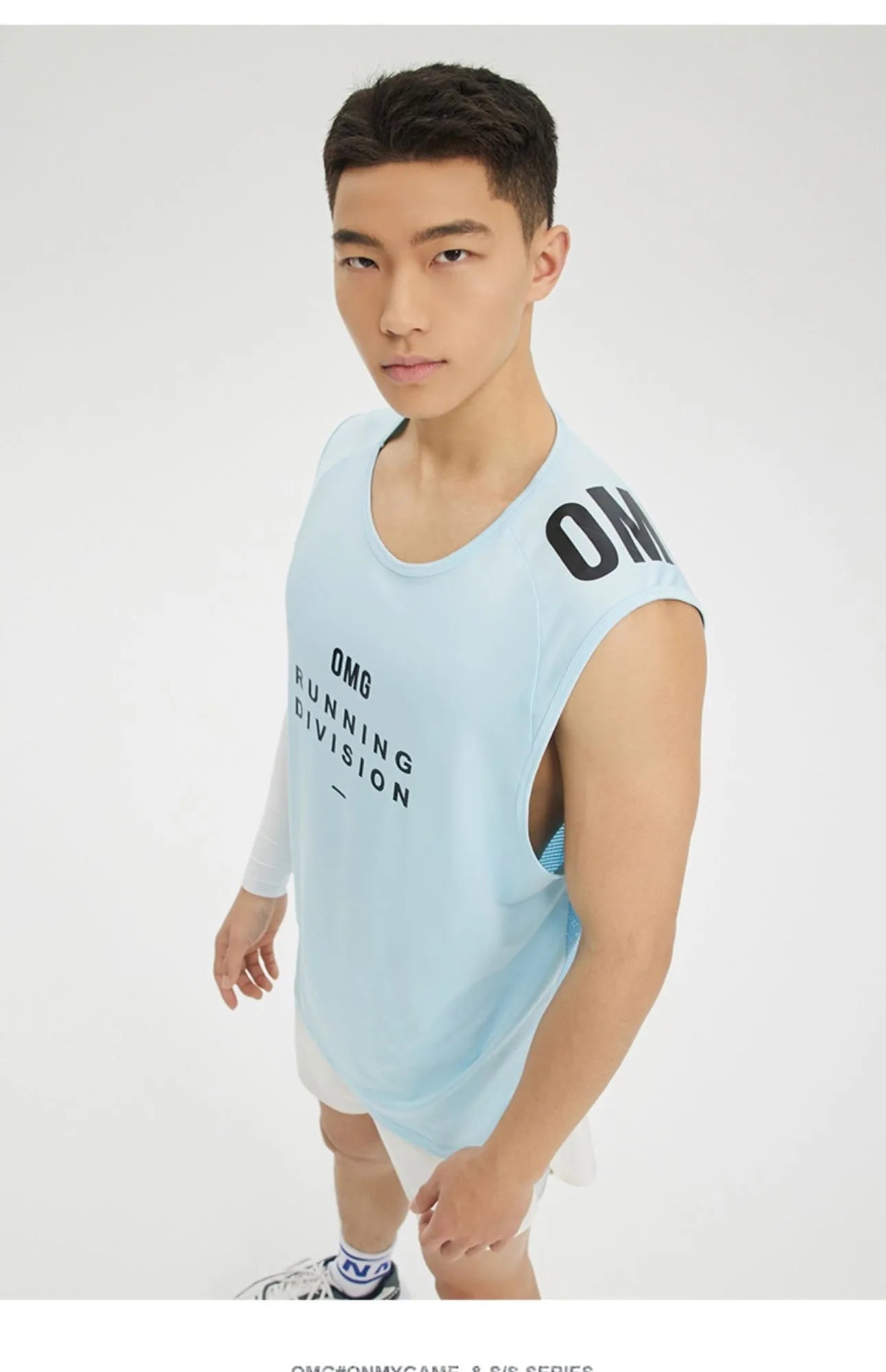 Men's loose fit mesh sports vest in black, showing lightweight wicking fabric and straight hem design.