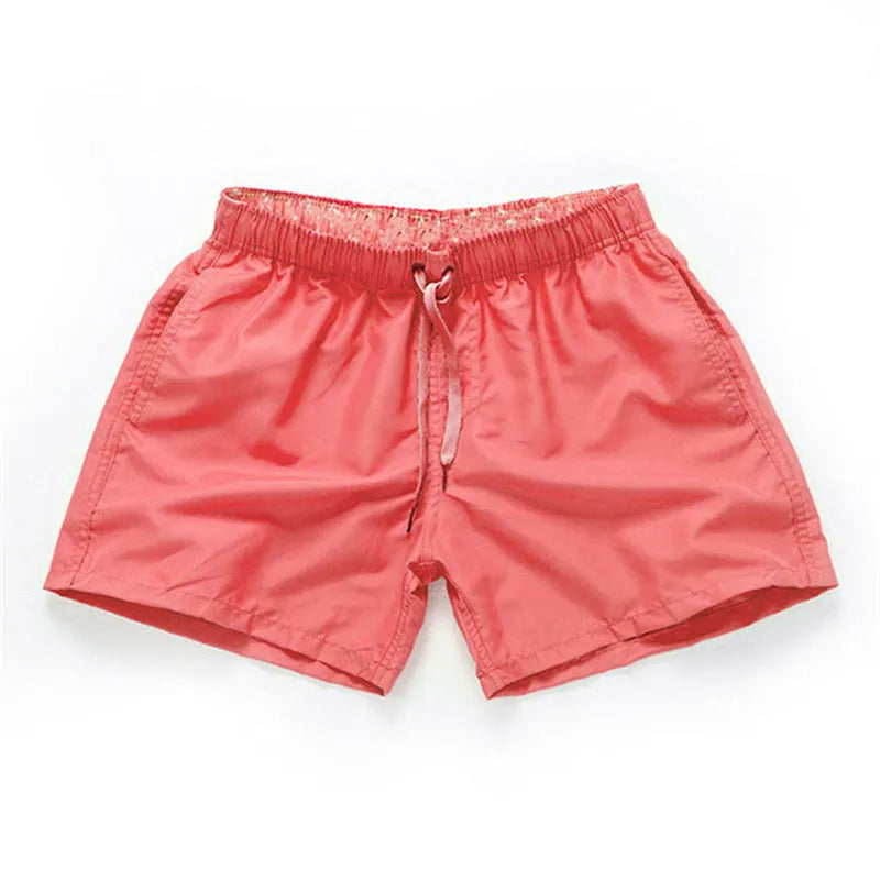 Men's black polyester beach shorts with straight leg opening on a mannequin