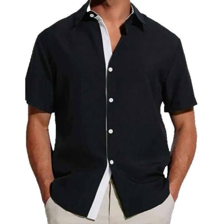 Men's short-sleeved floral print polyester shirt in grey on a hanger.