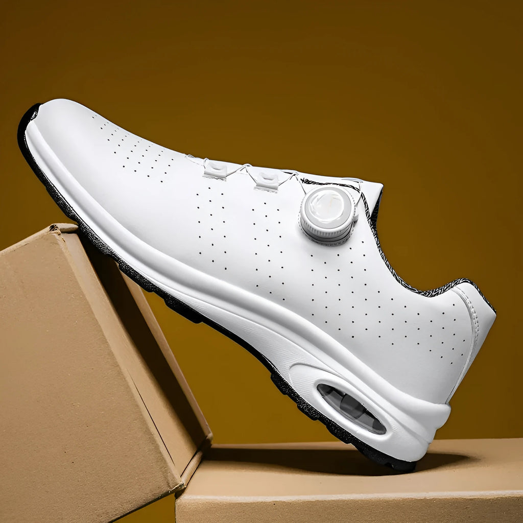 Black and white low top mesh tennis shoes with composite sole and cross shoulder straps