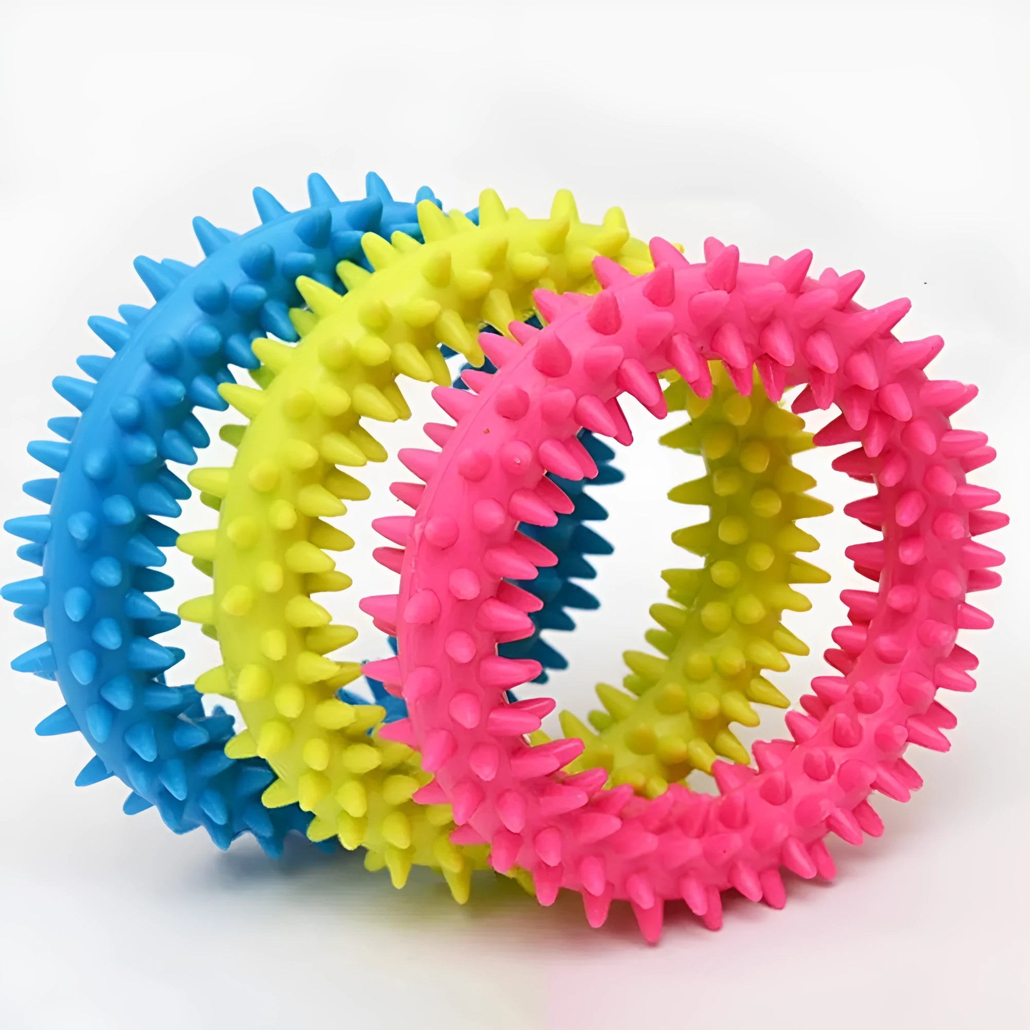 Blue TPR spiky circle dog chew toy on a white background showing dental nubs and ring shape.