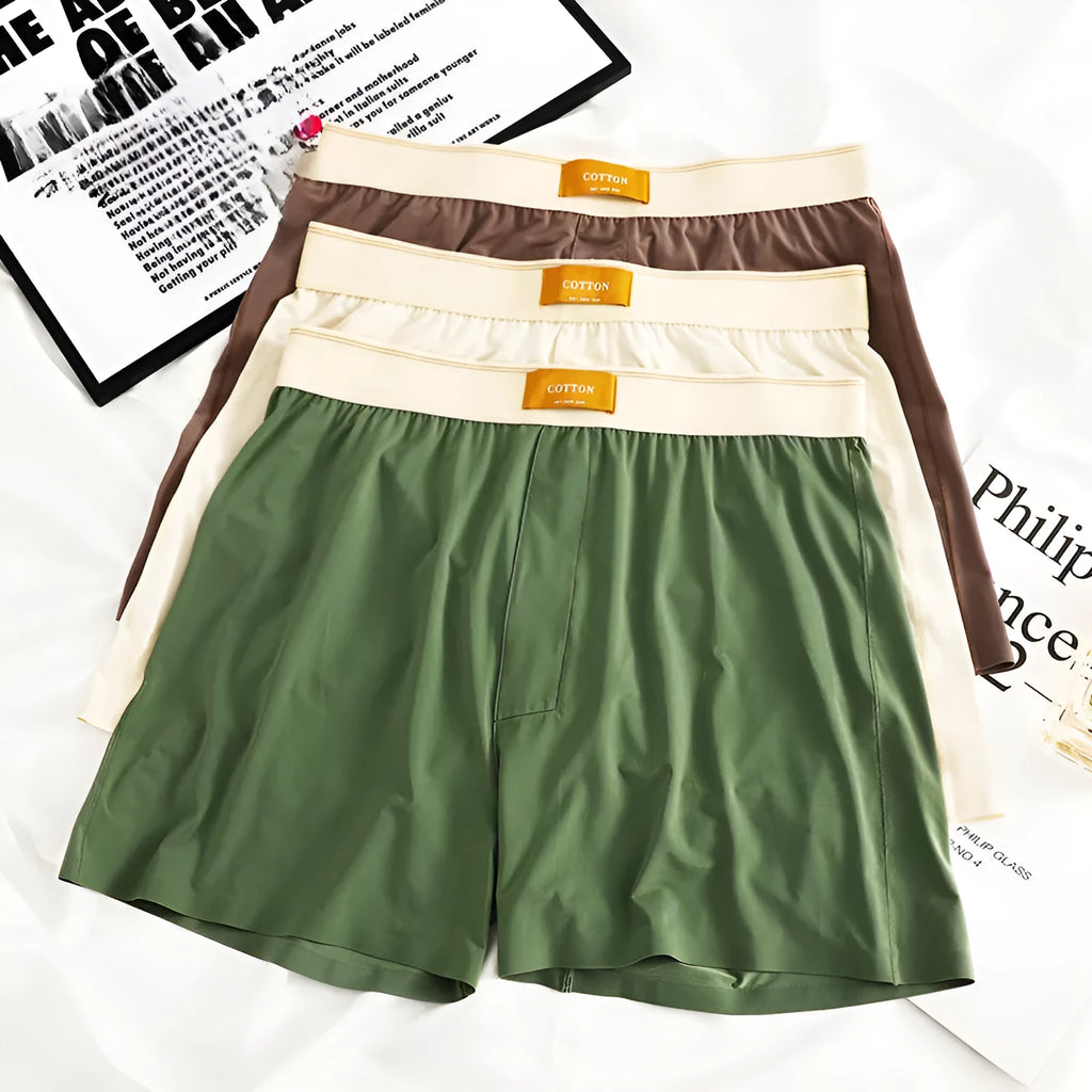 Three pairs of men's solid colour ice silk underwear showing loose fit and mid waist design
