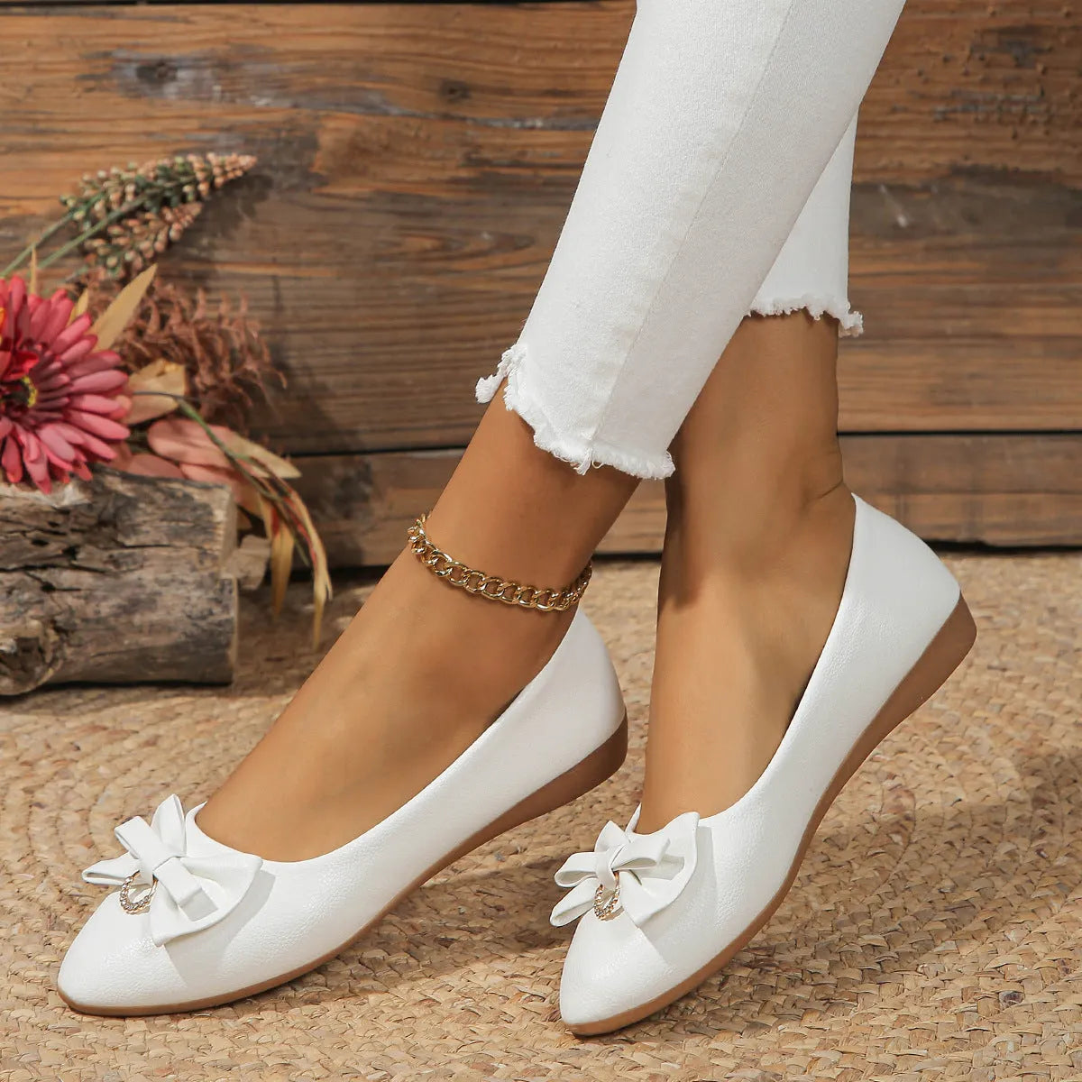 Women's beige casual flat shoes with a bowknot detail and slip-on shallow mouth design.