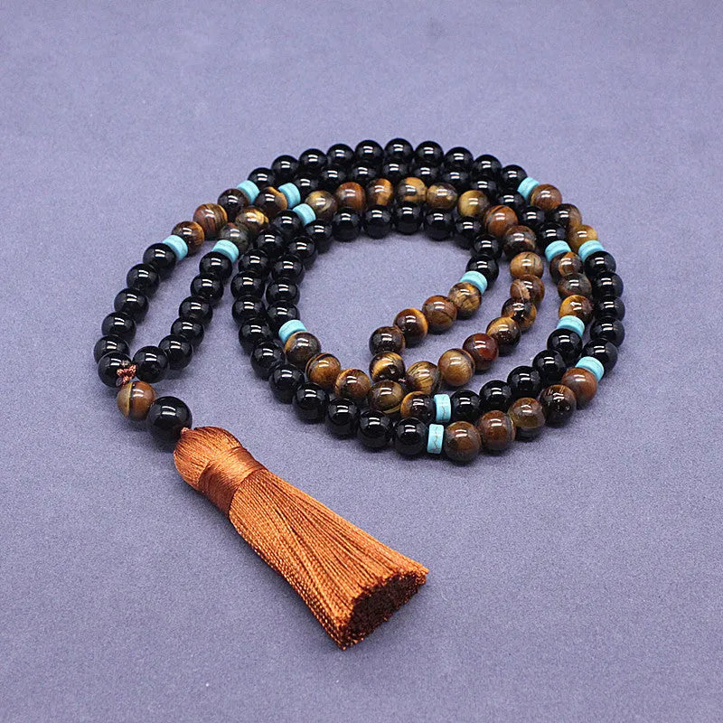 Black agate jewellery set showing tiger-eye stone necklace and geometry bead bracelet