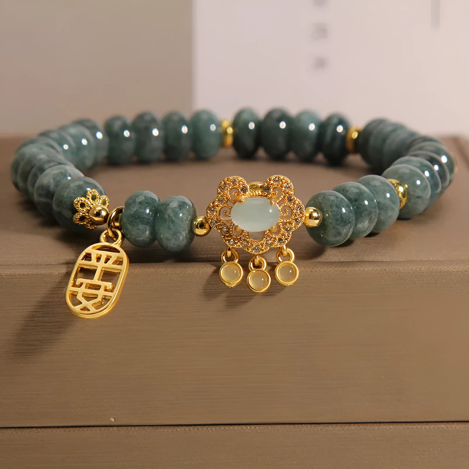 Women's natural emerald jade bracelet with abacus bead design and alloy safety lock closure