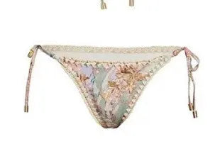 Women's creamy-white floral bikini set with top, briefs, and skirt for beach swimming