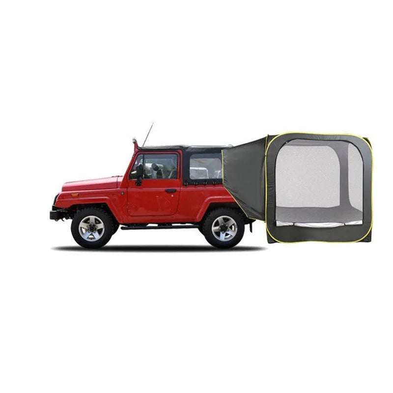 Black pop-up car tailgate camping tent unfolded next to a vehicle
