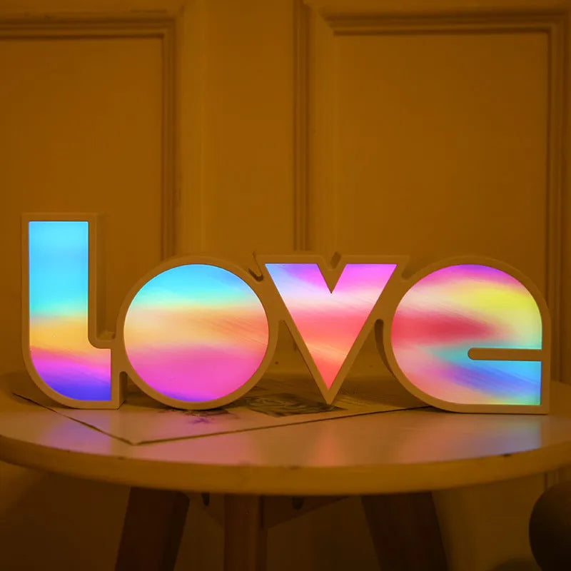 Colourful rainbow LED decorative light spelling LOVE, with USB cable, for Valentine's Day or wedding decor.