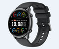 Round smart sports watch with black silicone strap showing heart rate data on touch screen.