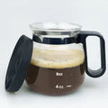 Transparent borosilicate glass coffee maker with silicone protective cover showing brewing capacity