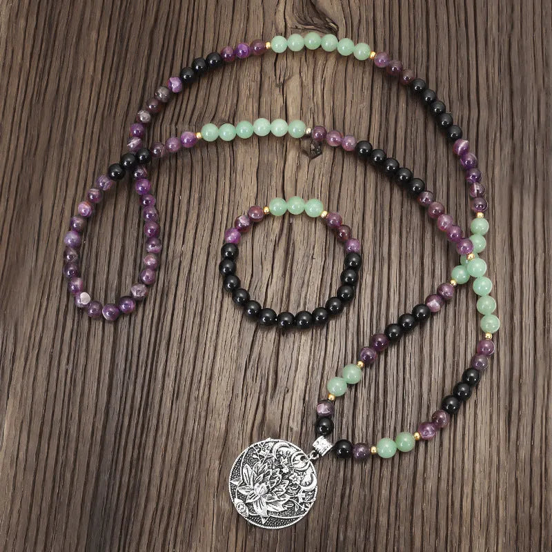 Handmade stone bead necklace with geometric alloy lotus pendant and matching adjustable bracelet.