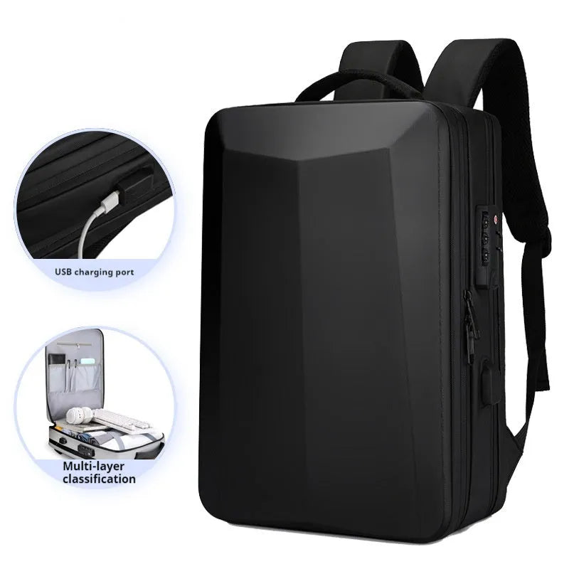 Black waterproof ABS PC business backpack with a curved shoulder strap, shown next to a laptop.