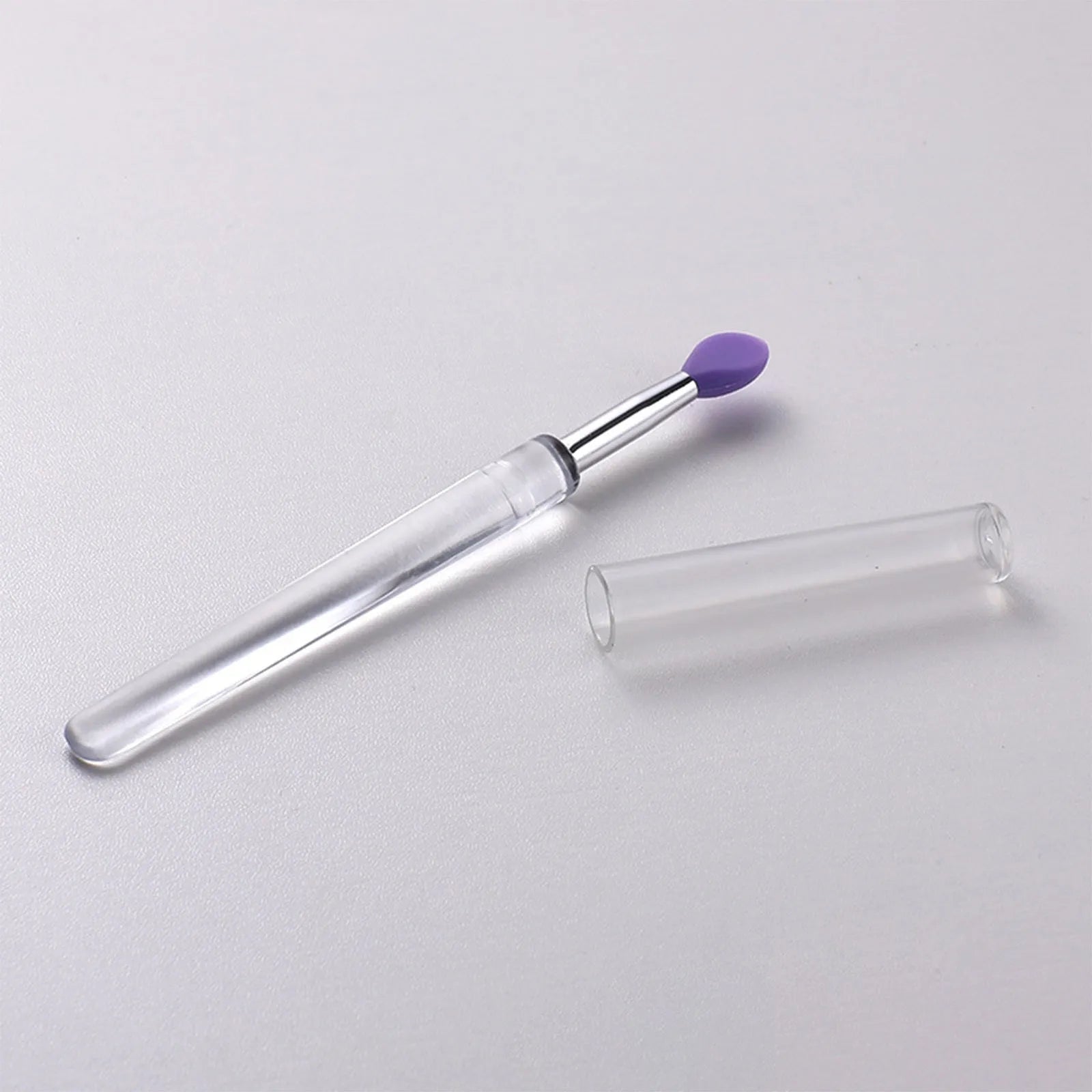 Reusable silicone lip brush set with protective caps in eight colour options