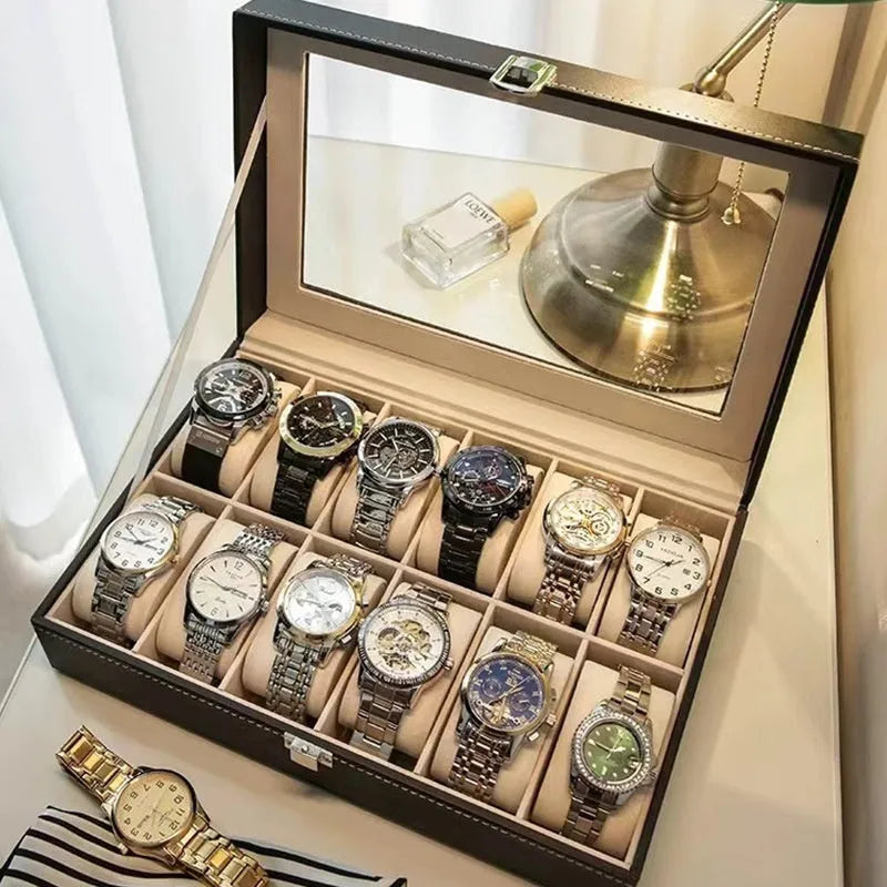 Grey high-grade leather watch storage box with a transparent see-through lid on a wooden surface.