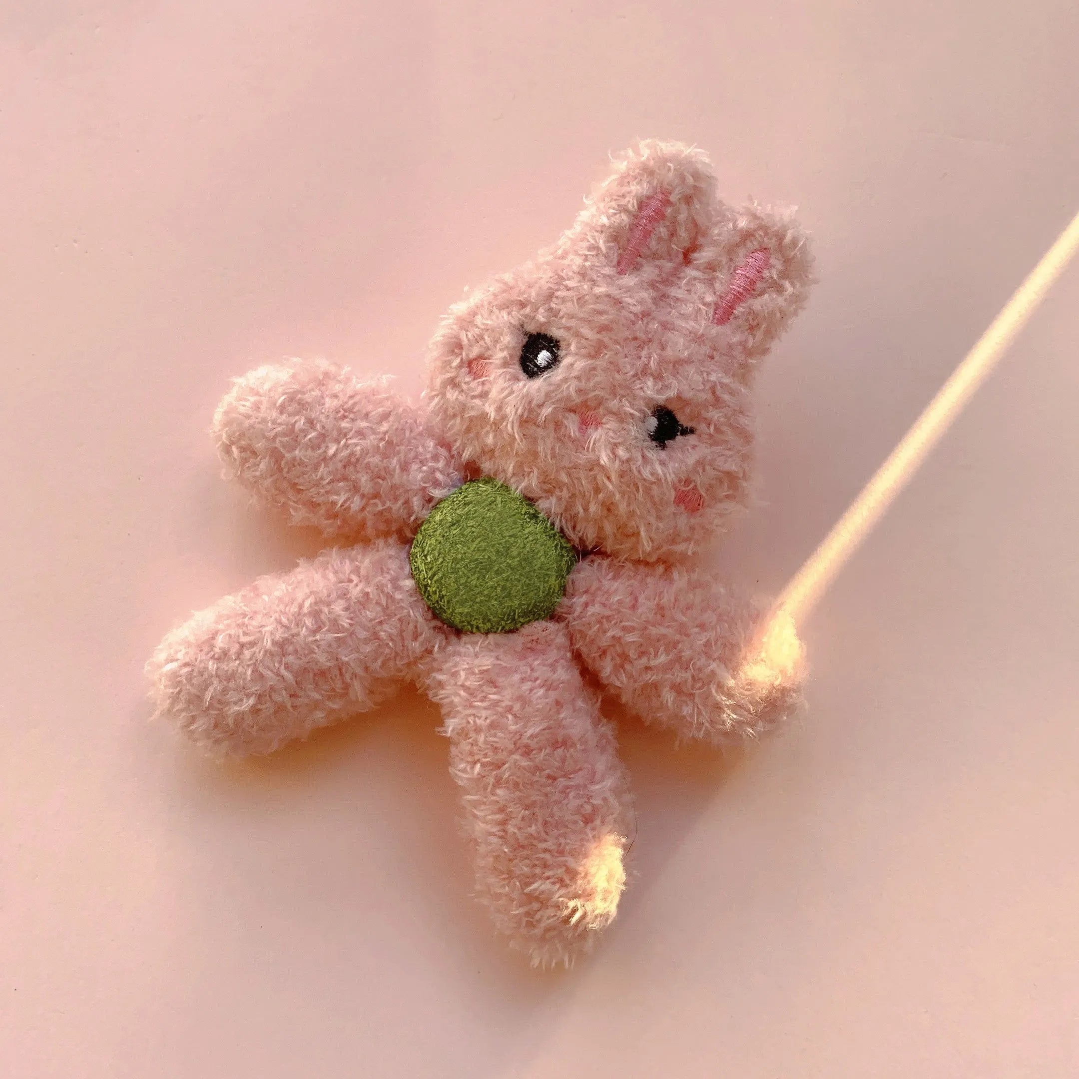 Edible catnip ball chewing toy in animal shapes for cleaning cat teeth.