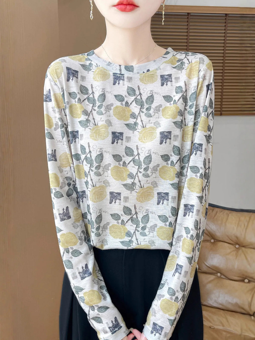 Women's round neck pullover shirt in Tencel cotton with a yellow roses floral print design.