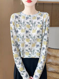 Women's round neck pullover shirt in Tencel cotton with a yellow roses floral print design.
