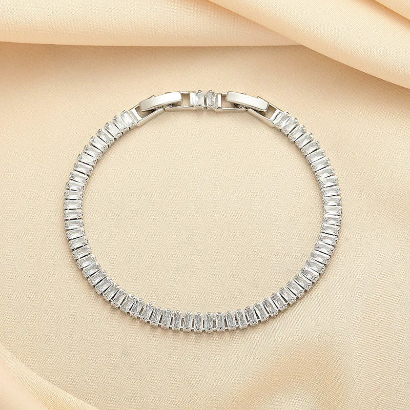 Rectangular geometric women's bracelet with full diamond zircon treatment in champagne gold colour