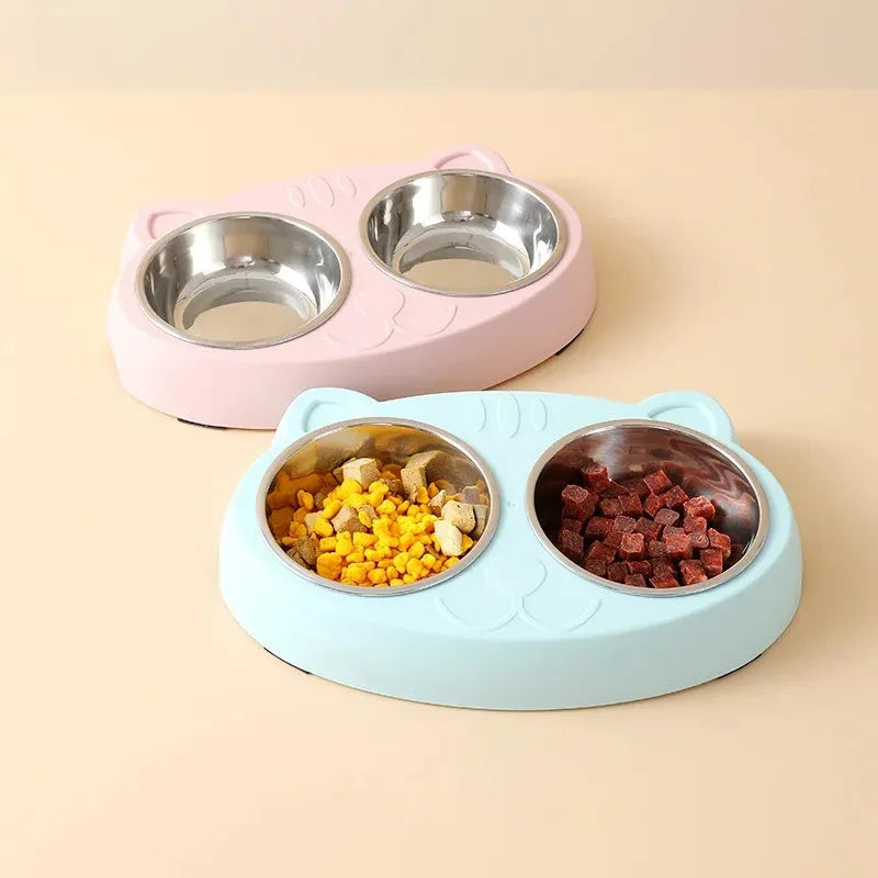 Blue macaron-shaped plastic pet feeder tray with two bowls for food and water.