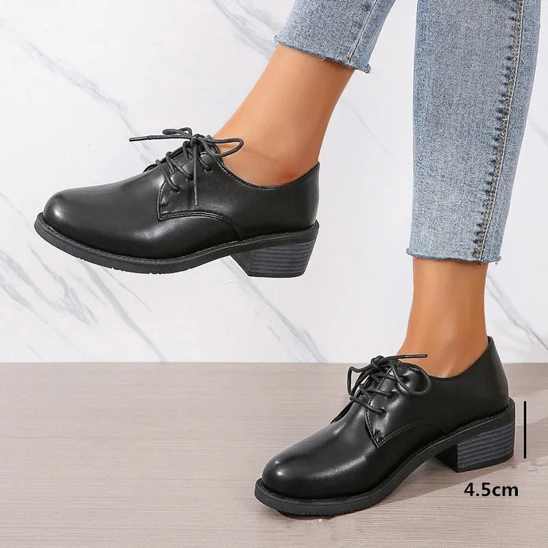 Black women's professional work shoes with thick chunky heel and low-top design