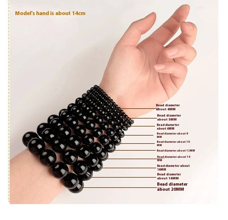 Smokey violet Hetian jade straight cut beaded bracelet on a wrist.