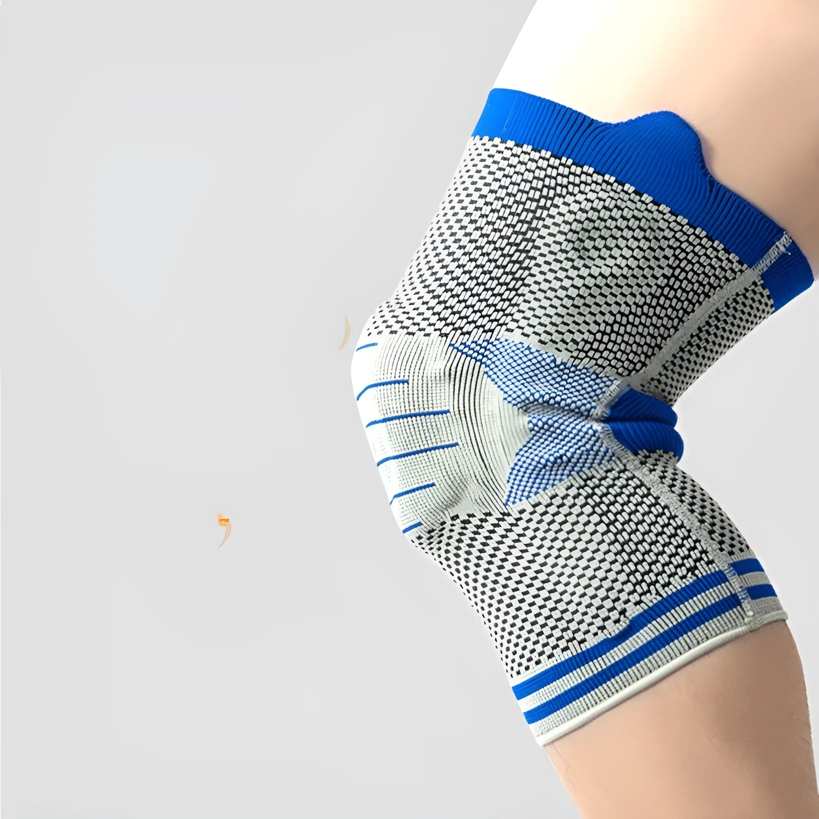 Close-up of a grey and blue cotton knee pad showing the silicone massage spring bar and shock absorber design.