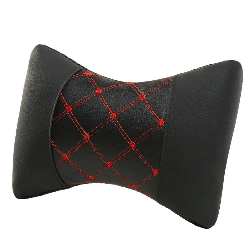 Leather quilted car headrest neck pillow with diamond check pattern in black with contrasting stitching
