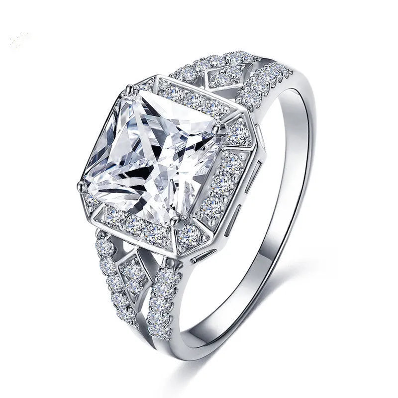 Women's platinum-colour hollow geometric zircon ring on a copper band, shown in size 7.
