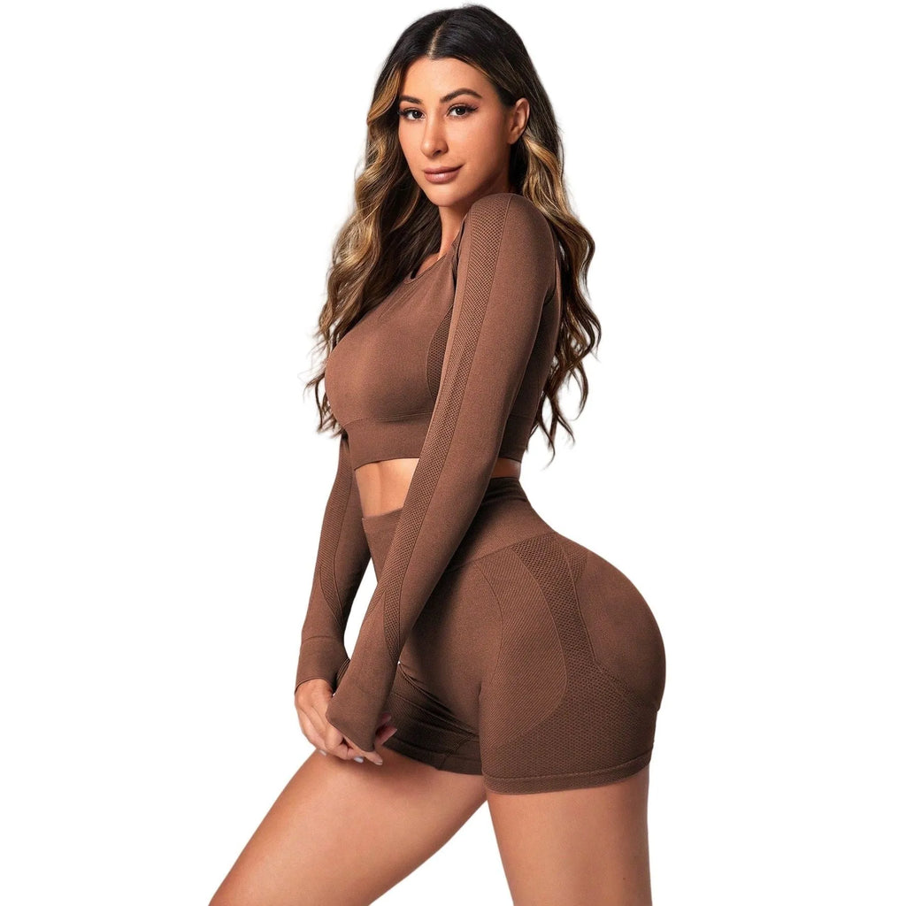 Women's high waist yoga suit in black, brown, or purple colours, showing pullover top and tight-fitting pants.