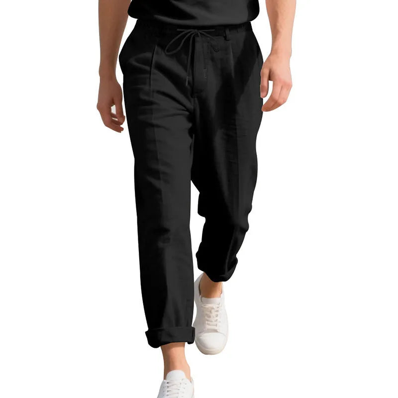 Men's light khaki linen casual trousers with a loose straight-leg fit and drawstring waist.