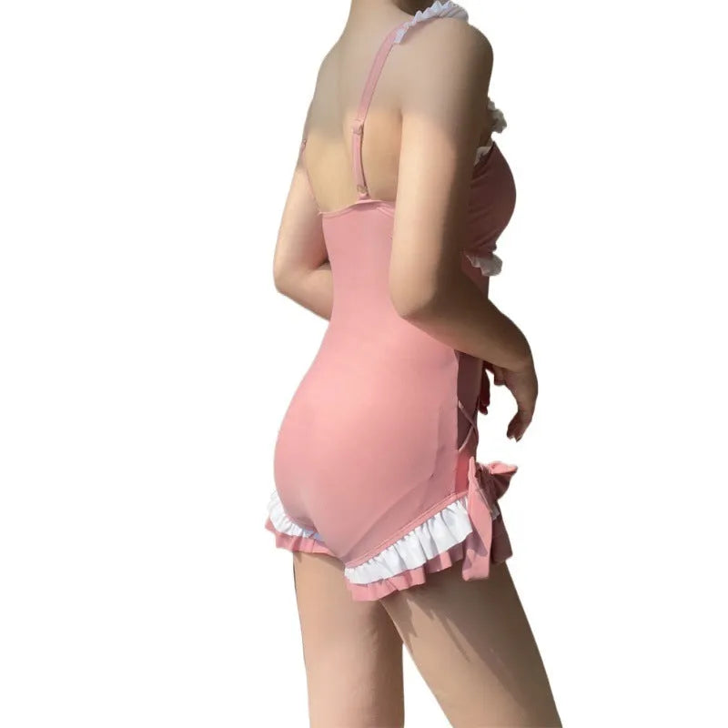 Women's one-piece milk silk swimsuit in solid pink colour with sleeveless design, available in sizes S to XL