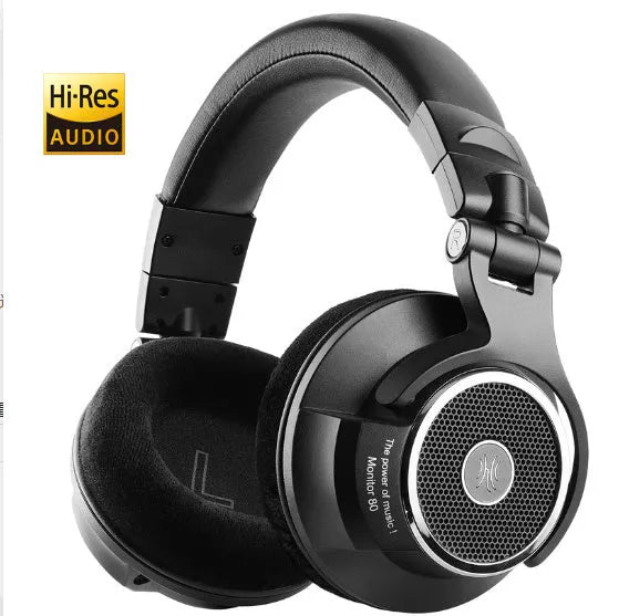 Wired noise reduction monitor headset with 40mm driver and dual 3.5mm/6.5mm plugs on black background