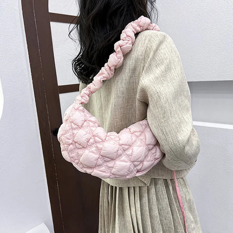 Beige nylon women's casual shoulder messenger bag with a long strap, shown from the side.