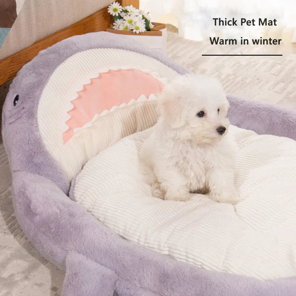 Blue shark pattern velvet pet bed cushion for dogs and cats on a wooden floor.