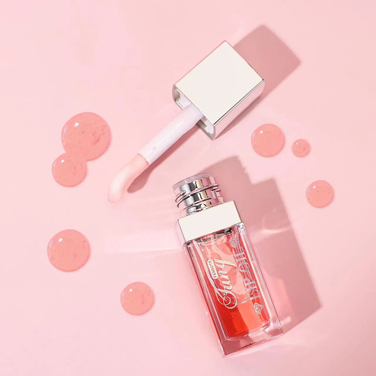 Mint lipstick set with five colour shades and a lip essence oil bottle.