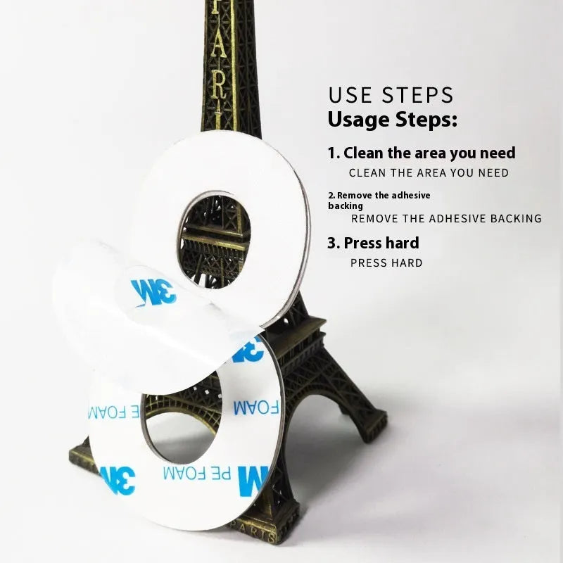 Black stainless steel adhesive house number sign showing digit 7, 7.5cm tall on adhesive backing.