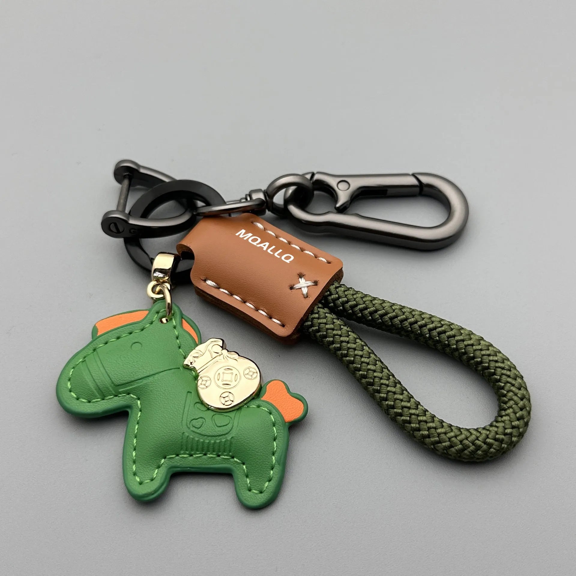 Handmade zinc alloy cowhide car key pendant on a flannel rope strap in various colour options.
