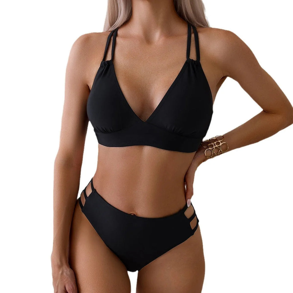 Women's black halter V-neck bikini top and matching split-style swim shorts.