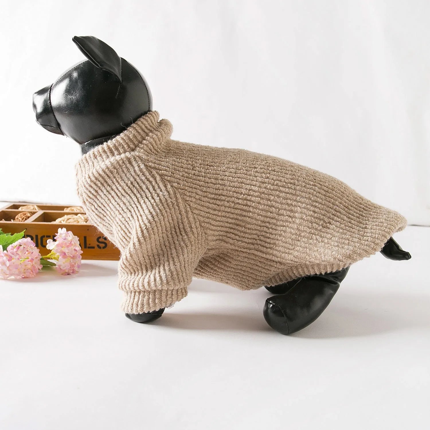 Brown cloth dog sweater pullover for small breeds on size chart showing XS to XL